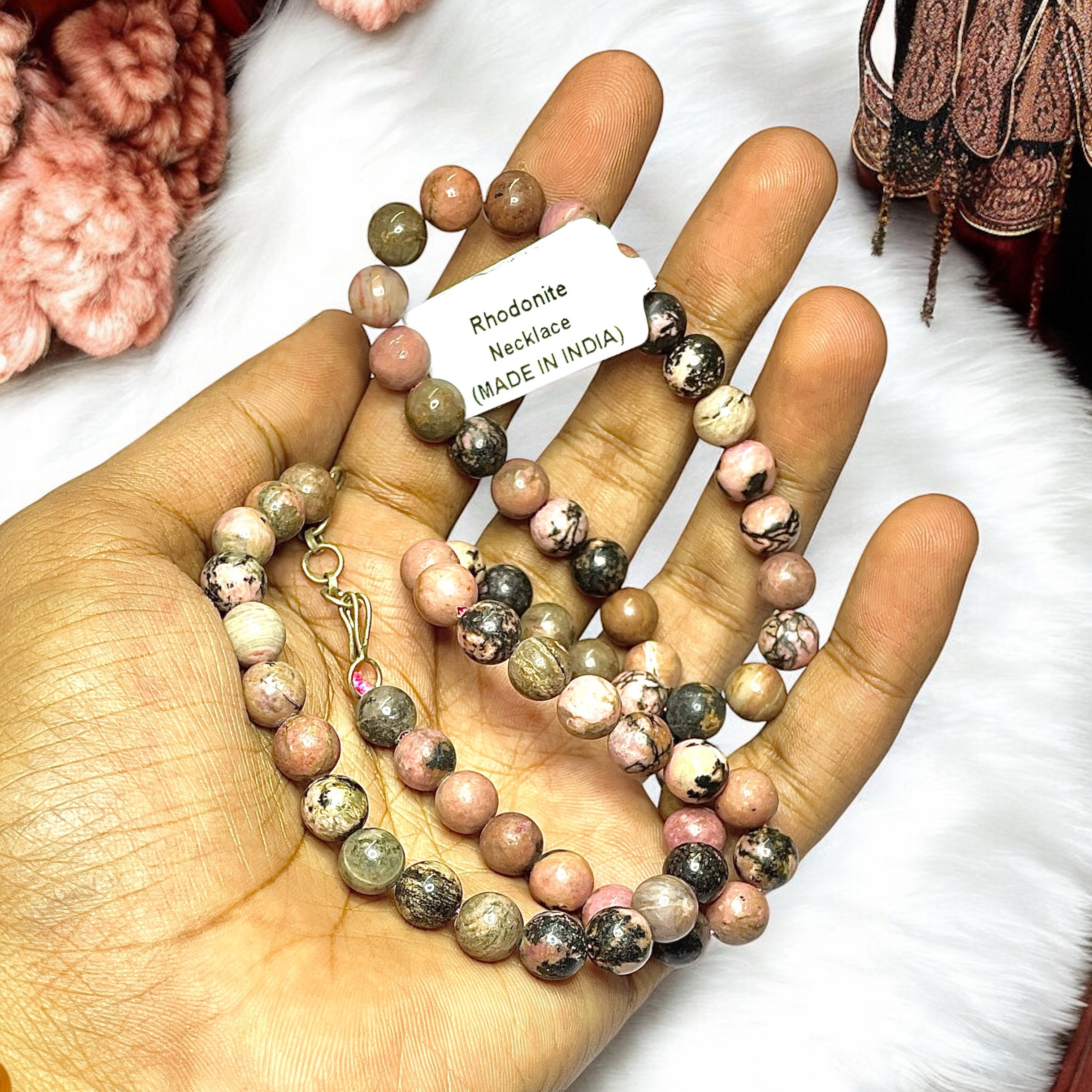 Rhodonite Crystal Necklace. Discover the Power of Natural Crystals with Rocksmins: Elegantly Crafted Crystal Necklaces Infused with Authentic Energies for Enhanced Well-Being and Spiritual Growth
