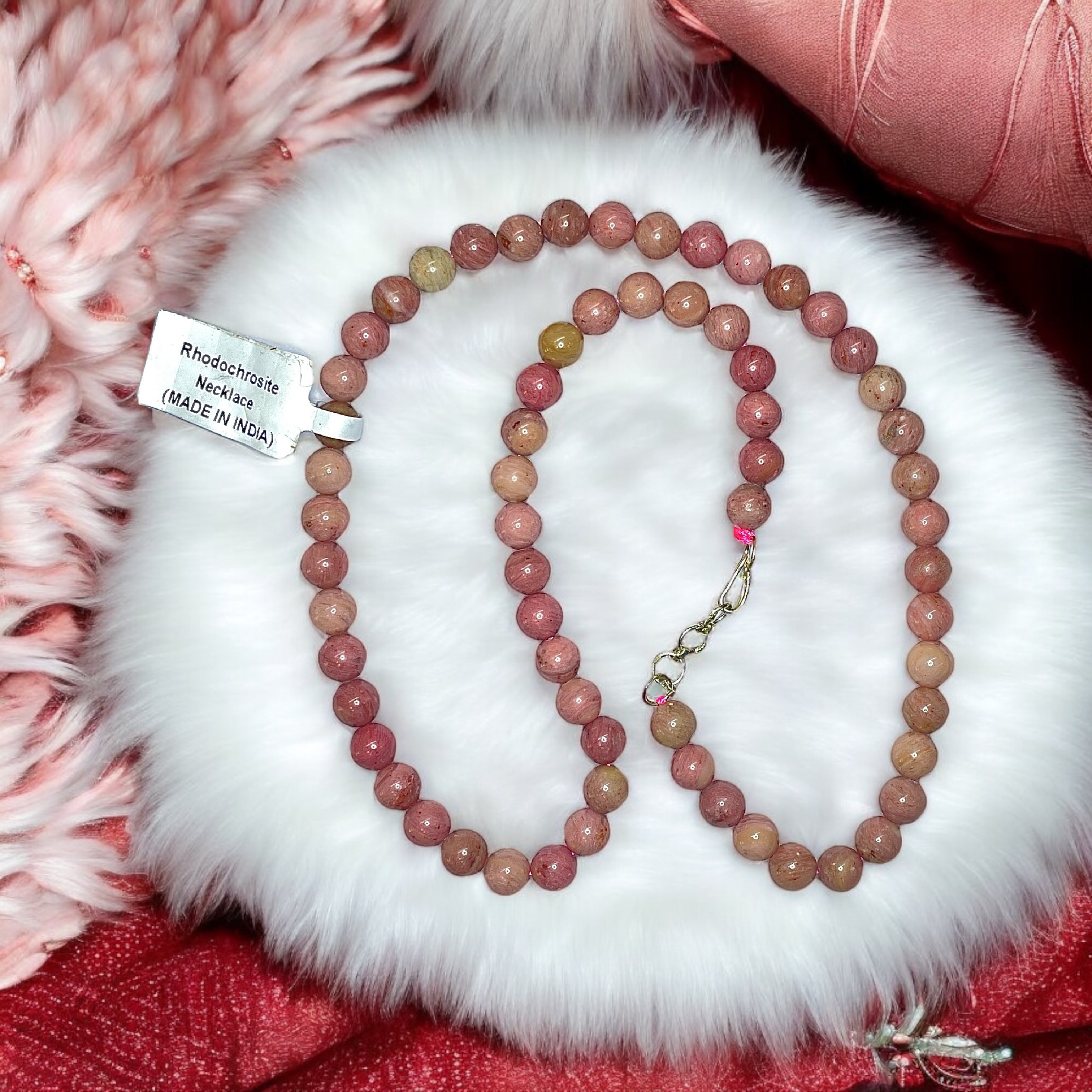 Rhodochrosite Crystal Necklace. Discover the Power of Natural Crystals with Rocksmins: Elegantly Crafted Crystal Necklaces Infused with Authentic Energies for Enhanced Well-Being and Spiritual Growth
