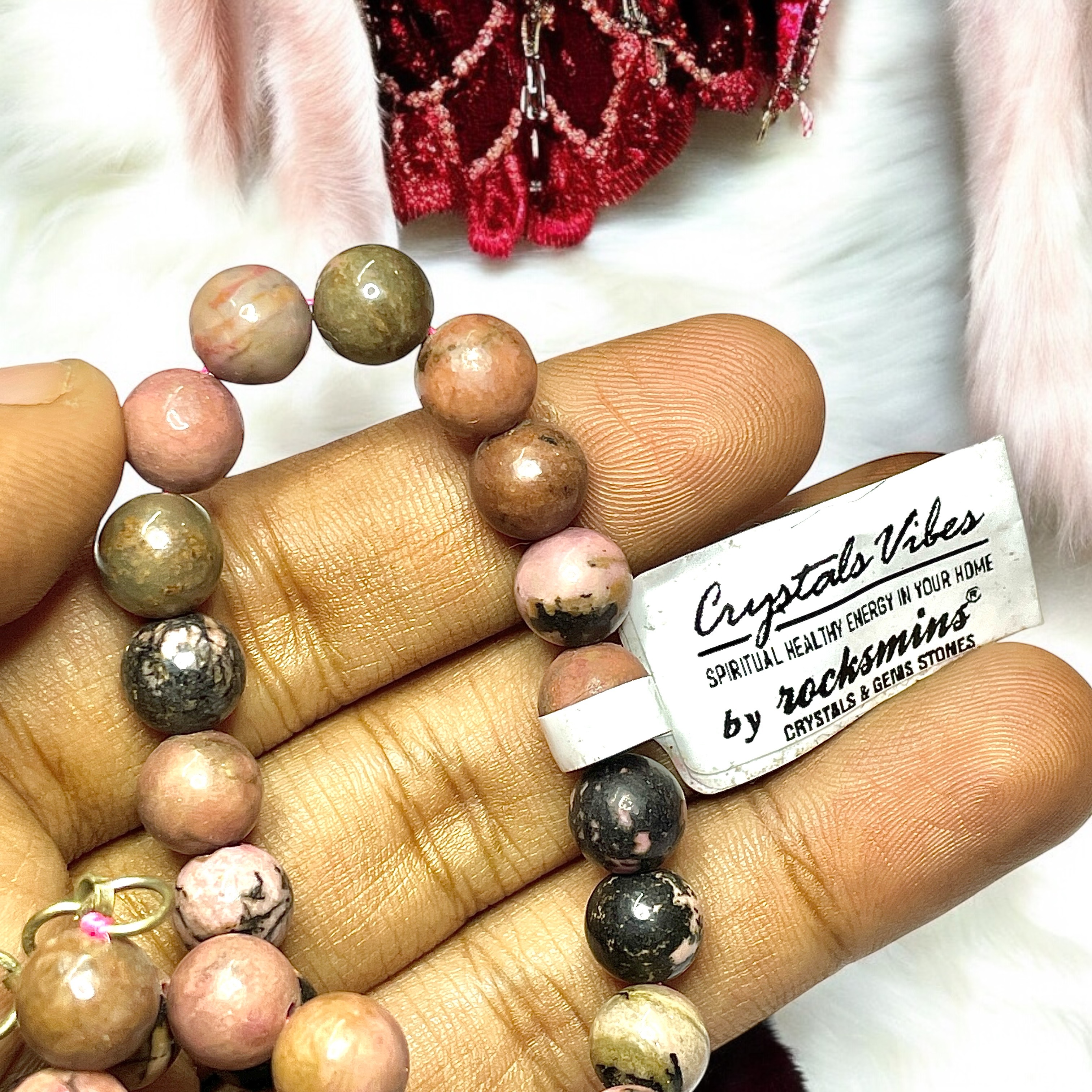 Rhodonite Crystal Necklace. Discover the Power of Natural Crystals with Rocksmins: Elegantly Crafted Crystal Necklaces Infused with Authentic Energies for Enhanced Well-Being and Spiritual Growth