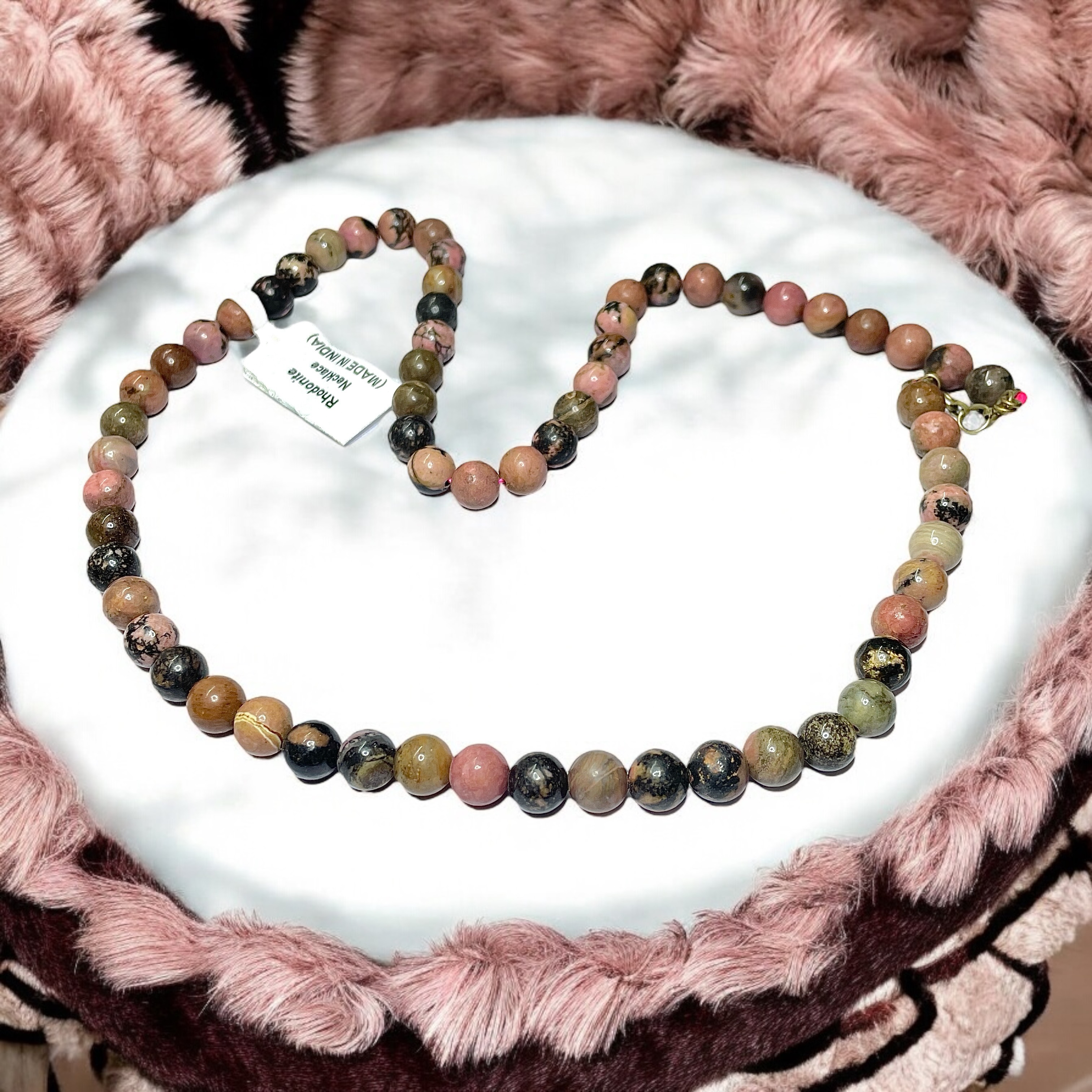 Rhodonite Crystal Necklace. Discover the Power of Natural Crystals with Rocksmins: Elegantly Crafted Crystal Necklaces Infused with Authentic Energies for Enhanced Well-Being and Spiritual Growth