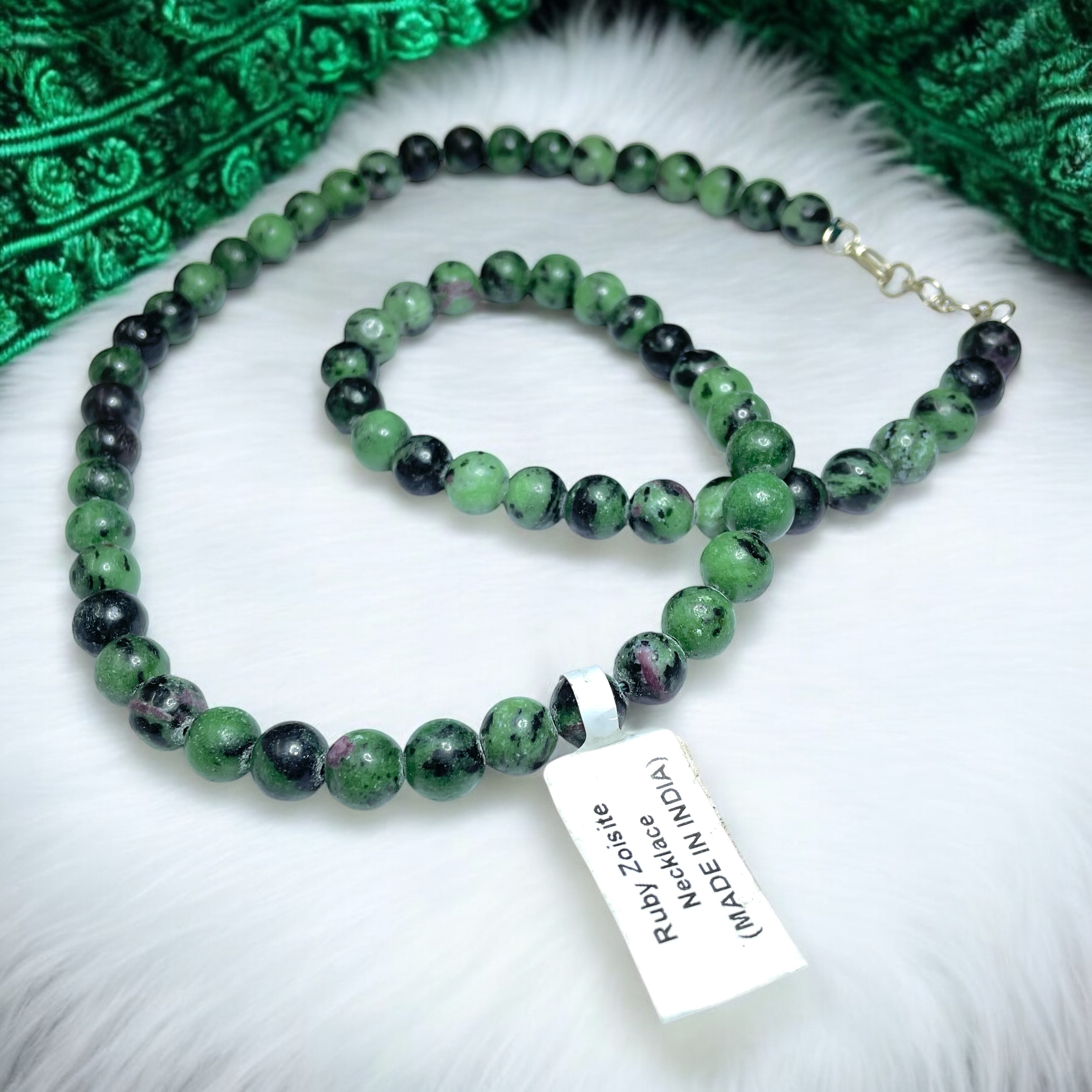 Ruby Zoisite Crystal Necklace. Discover the Power of Natural Crystals with Rocksmins: Elegantly Crafted Crystal Necklaces Infused with Authentic Energies for Enhanced Well-Being and Spiritual Growth