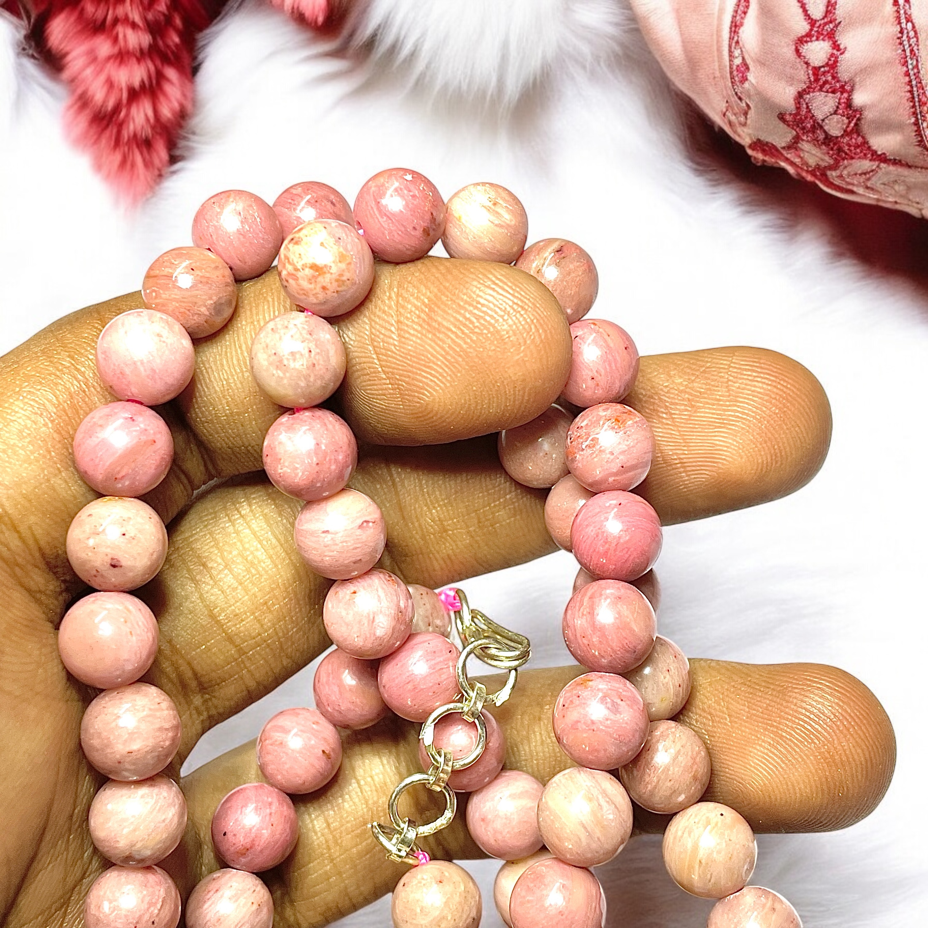 Rhodochrosite Crystal Necklace. Discover the Power of Natural Crystals with Rocksmins: Elegantly Crafted Crystal Necklaces Infused with Authentic Energies for Enhanced Well-Being and Spiritual Growth