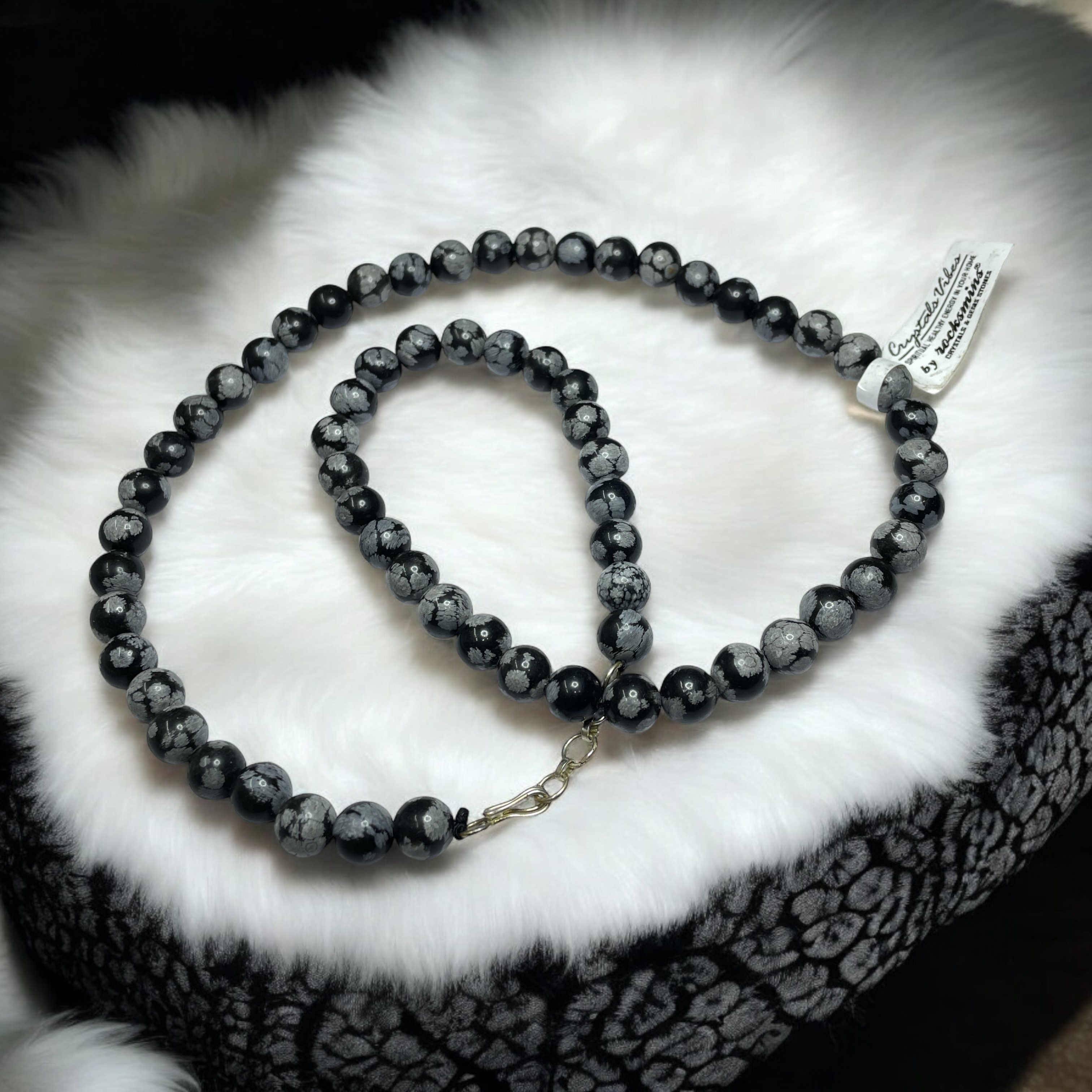 Snowflake Obsidian Crystal Necklace. Discover the Power of Natural Crystals with Rocksmins: Elegantly Crafted Crystal Necklaces Infused with Authentic Energies for Enhanced Well-Being and Spiritual Growth
