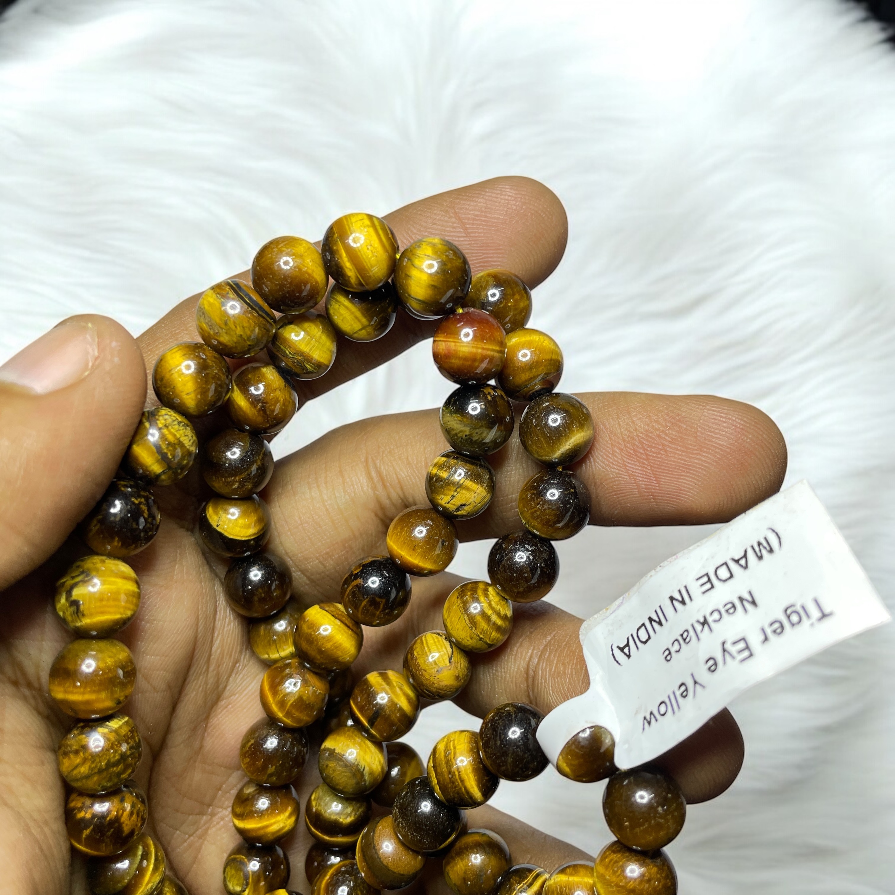 Tiger's Eye Yellow Crystal Necklace. Discover the Power of Natural Crystals with Rocksmins: Elegantly Crafted Crystal Necklaces Infused with Authentic Energies for Enhanced Well-Being and Spiritual Growth
