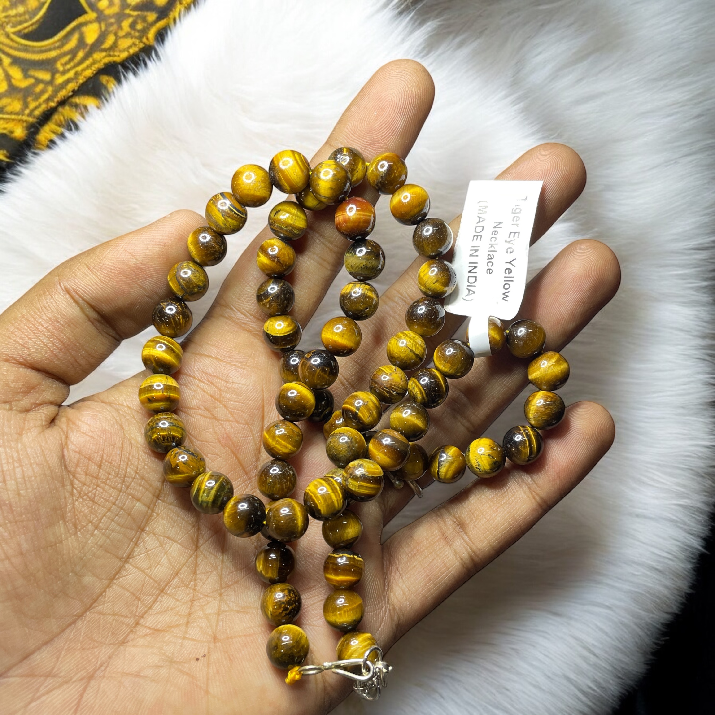 Tiger's Eye Yellow Crystal Necklace. Discover the Power of Natural Crystals with Rocksmins: Elegantly Crafted Crystal Necklaces Infused with Authentic Energies for Enhanced Well-Being and Spiritual Growth