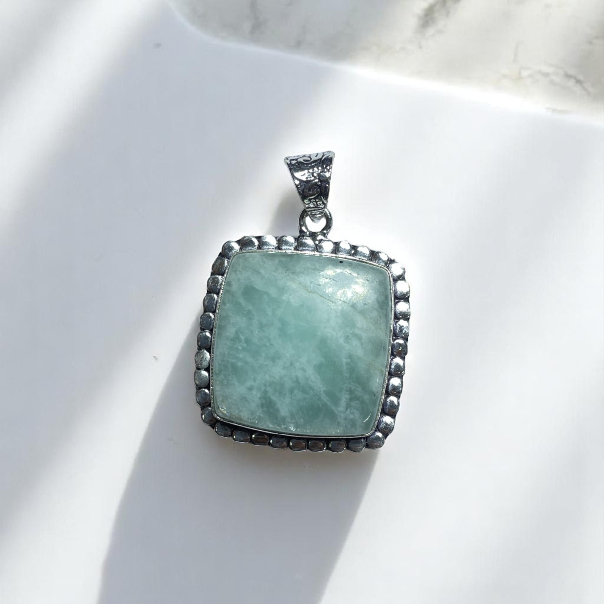 Amazonite Crystal Pendant Discover the Power of Natural Crystals with Rocksmins: Elegantly Crafted Crystal Pendant Infused with Authentic Energies for Enhanced Well-Being and Spiritual Growth