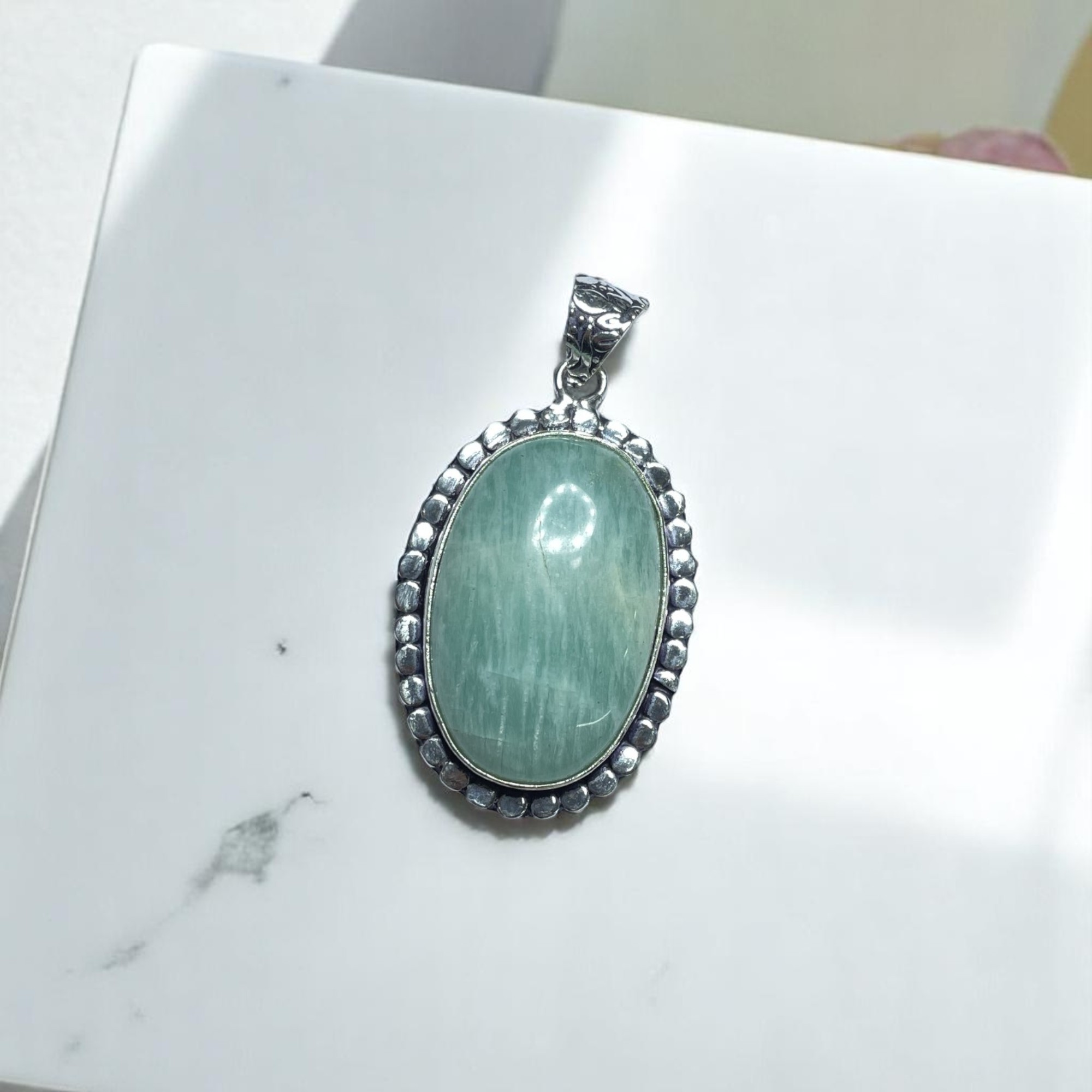 Amazonite Crystal Pendant Discover the Power of Natural Crystals with Rocksmins: Elegantly Crafted Crystal Pendant Infused with Authentic Energies for Enhanced Well-Being and Spiritual Growth