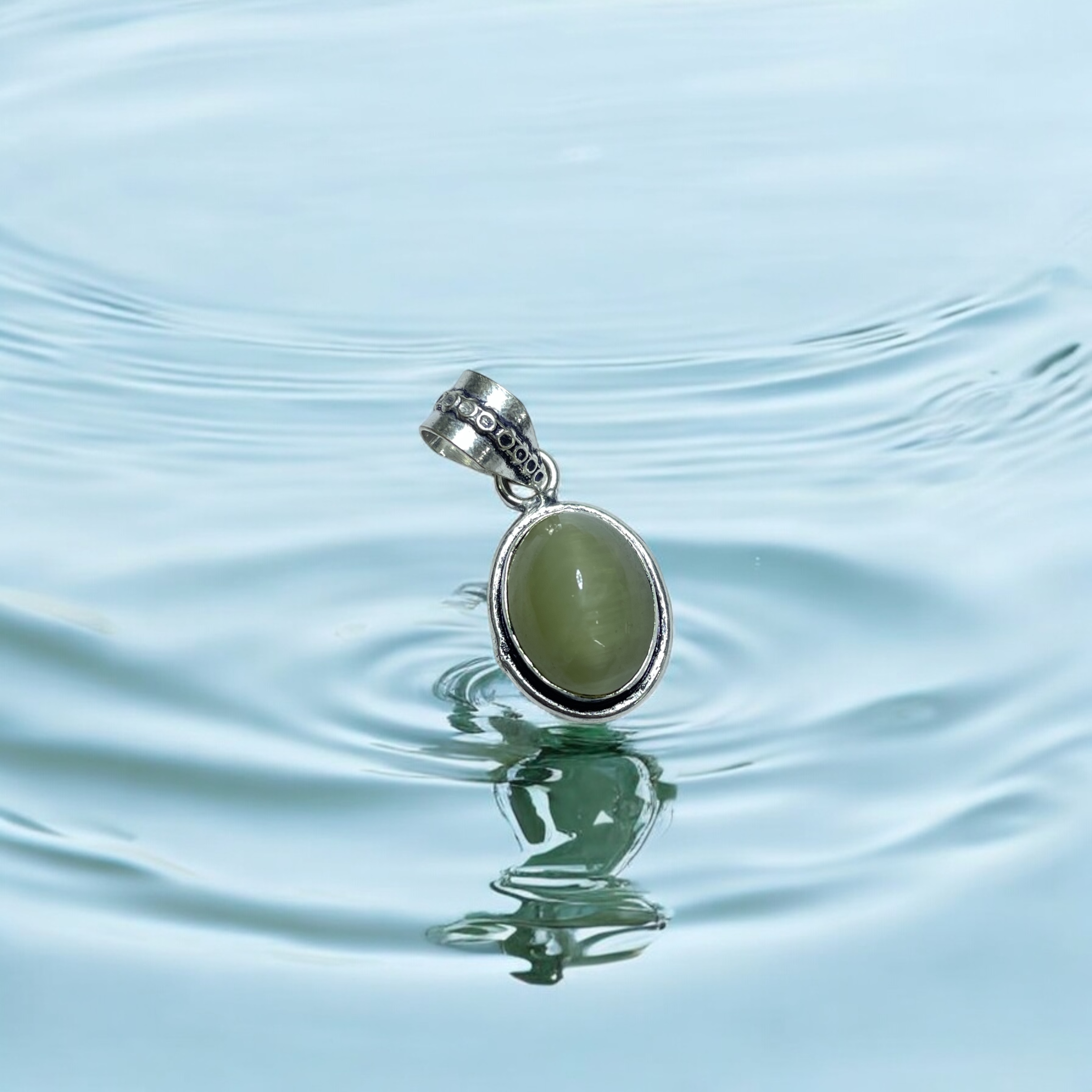 Cats Eye Crystal Pendant Discover the Power of Natural Crystals with Rocksmins: Elegantly Crafted Crystal Pendant Infused with Authentic Energies for Enhanced Well-Being and Spiritual Growth