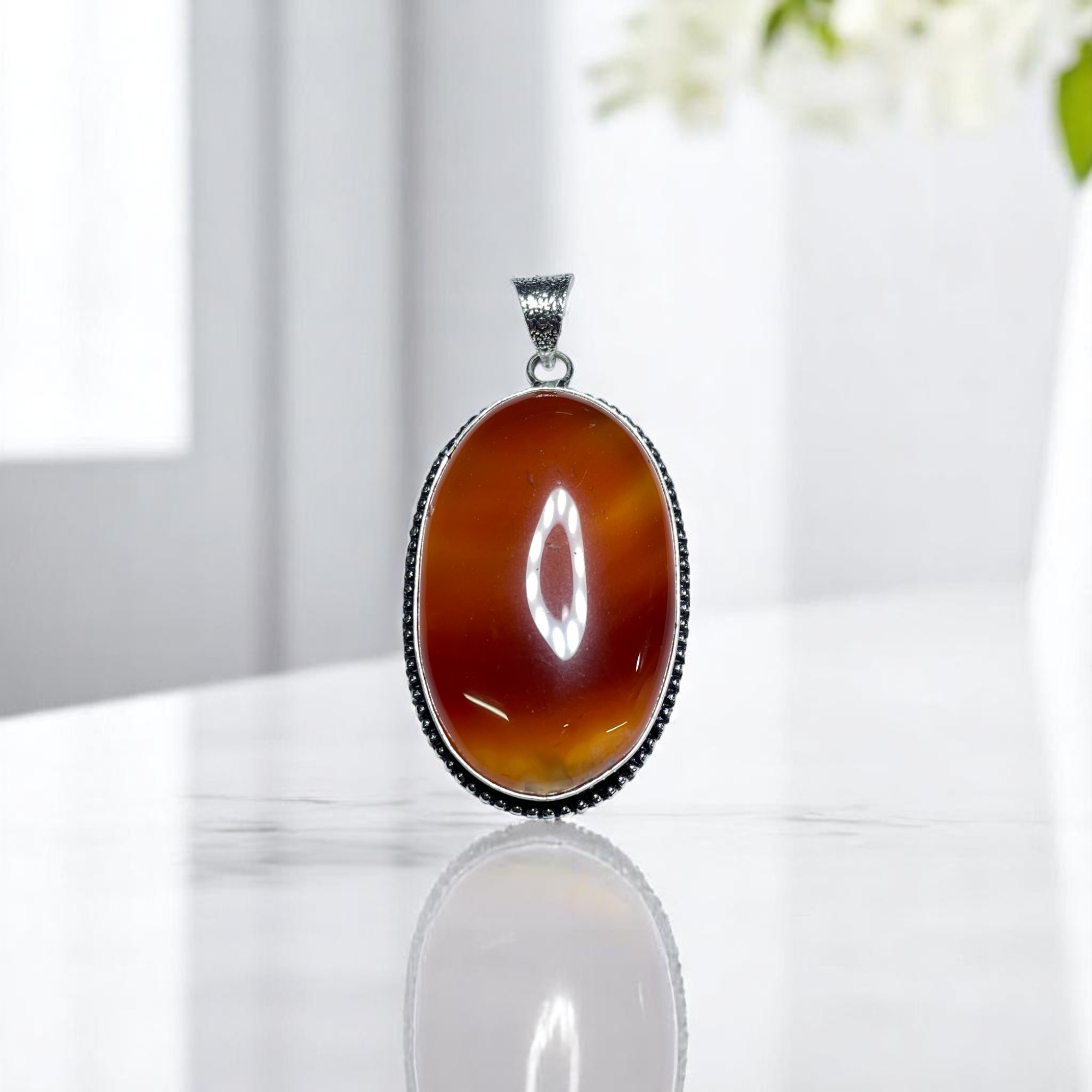 Carnelian Crystal Pendant Discover the Power of Natural Crystals with Rocksmins: Elegantly Crafted Crystal Pendant Infused with Authentic Energies for Enhanced Well-Being and Spiritual Growth