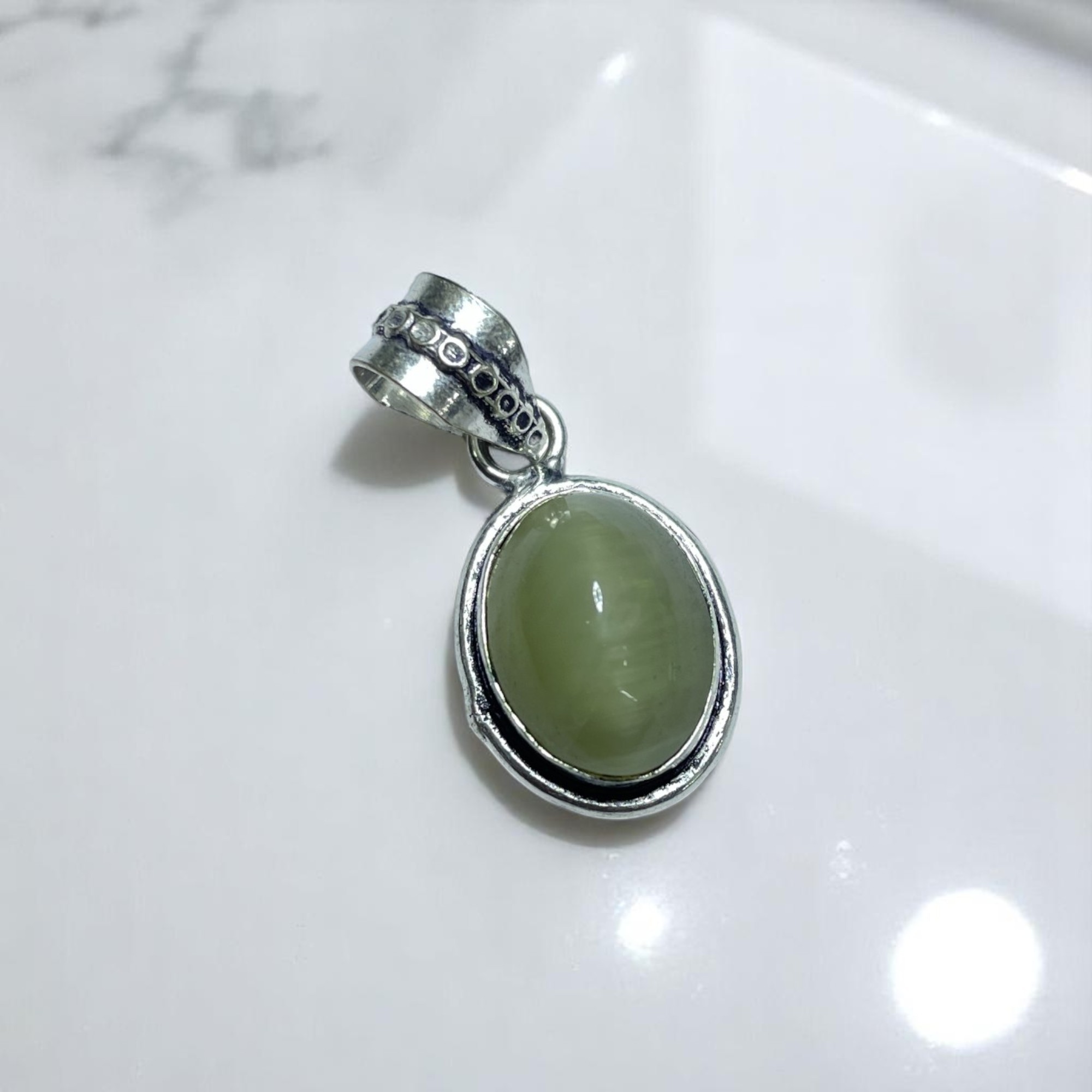 cats-eye-crystal-pendant-discover-the-power-of-natural-crystals-with-rocksmins-elegantly-crafted-crystal-pendant-infused-with-authentic-energies-for-enhanced-well-being-and-spiritual-growth