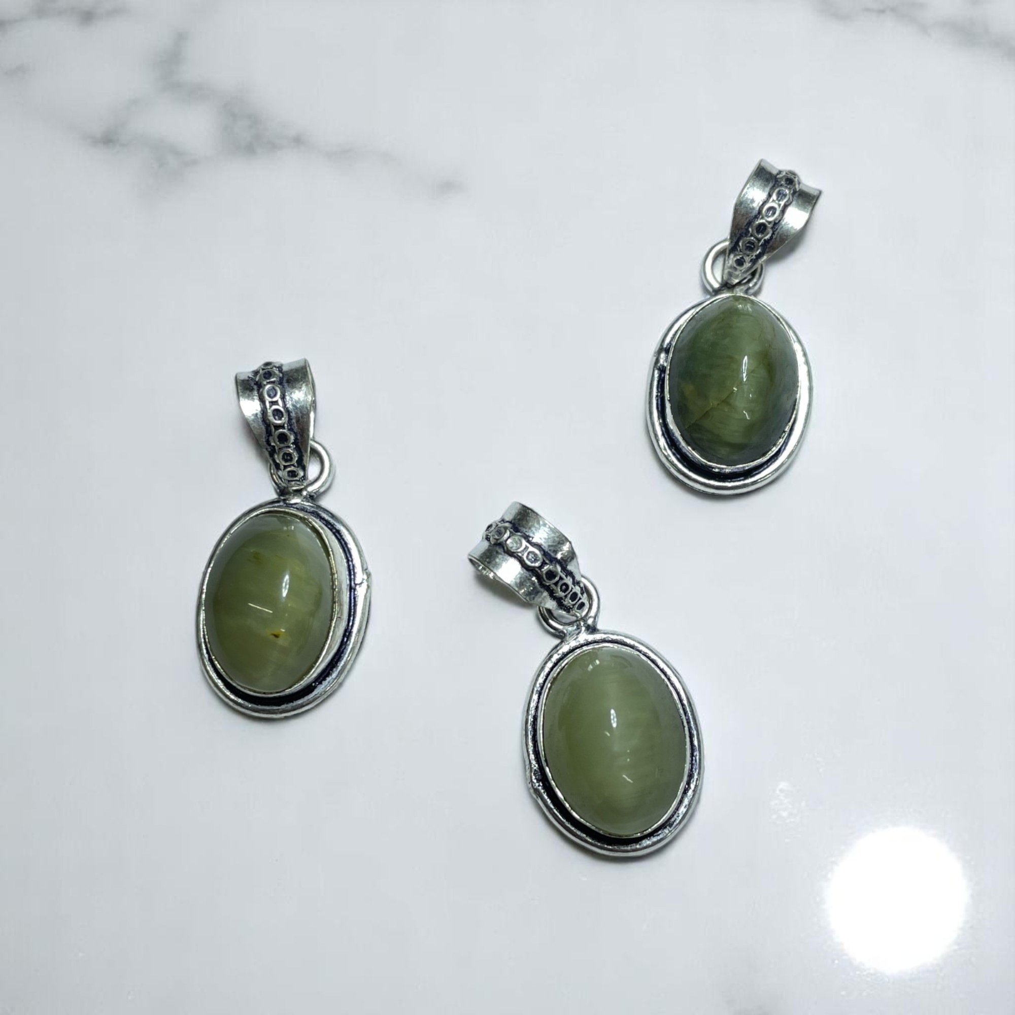 Cats Eye Crystal Pendant Discover the Power of Natural Crystals with Rocksmins: Elegantly Crafted Crystal Pendant Infused with Authentic Energies for Enhanced Well-Being and Spiritual Growth