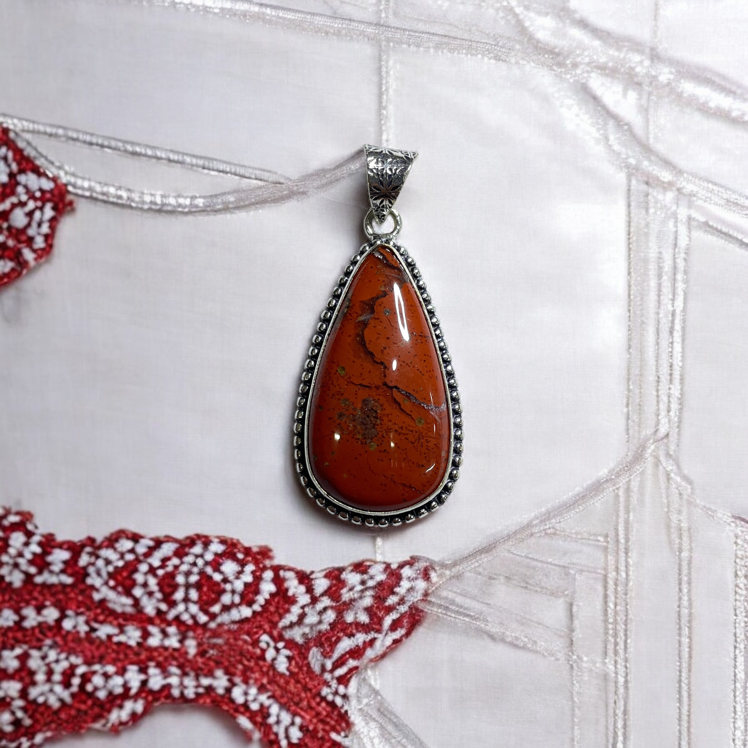 Jasper Red Crystal Pendant Discover the Power of Natural Crystals with Rocksmins. Elegantly Crafted Crystal Pendant Infused with Authentic Energies for Enhanced Well-Being and Spiritual Growth