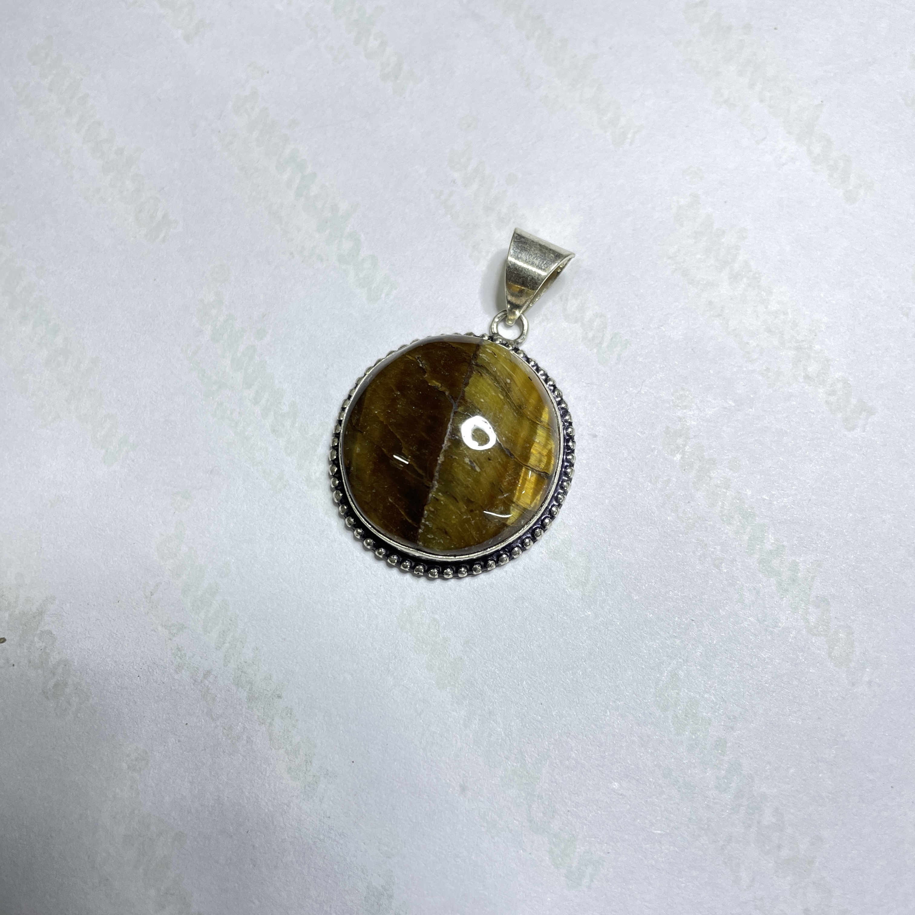 Tiger eye Yellow Crystal Pendant Discover the Power of Natural Crystals with Rocksmins. Elegantly Crafted Crystal Pendant Infused with Authentic Energies for Enhanced Well-Being and Spiritual Growth