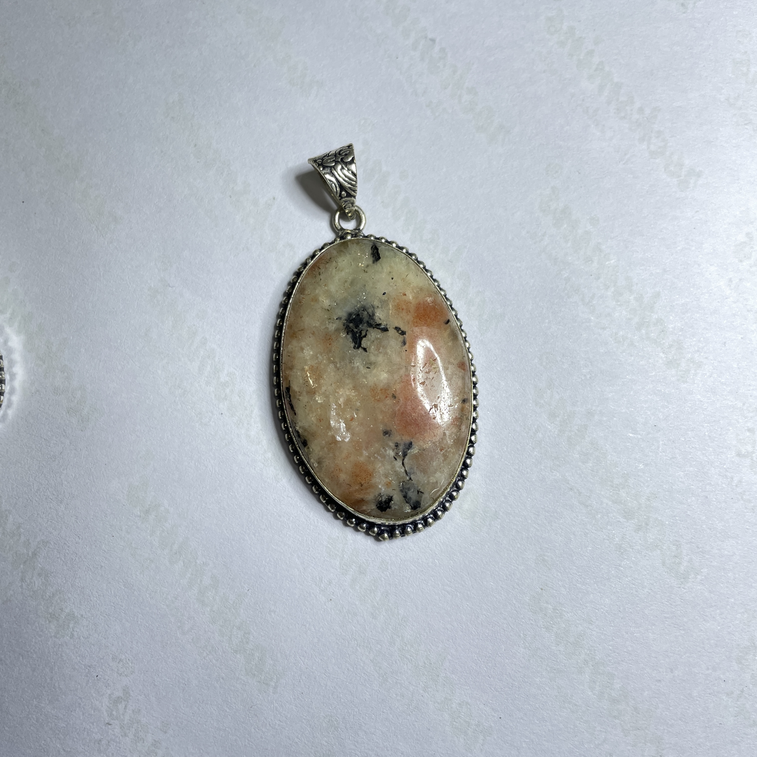 Sunstone Crystal Pendant Discover the Power of Natural Crystals with Rocksmins. Elegantly Crafted Crystal Pendant Infused with Authentic Energies for Enhanced Well-Being and Spiritual Growth