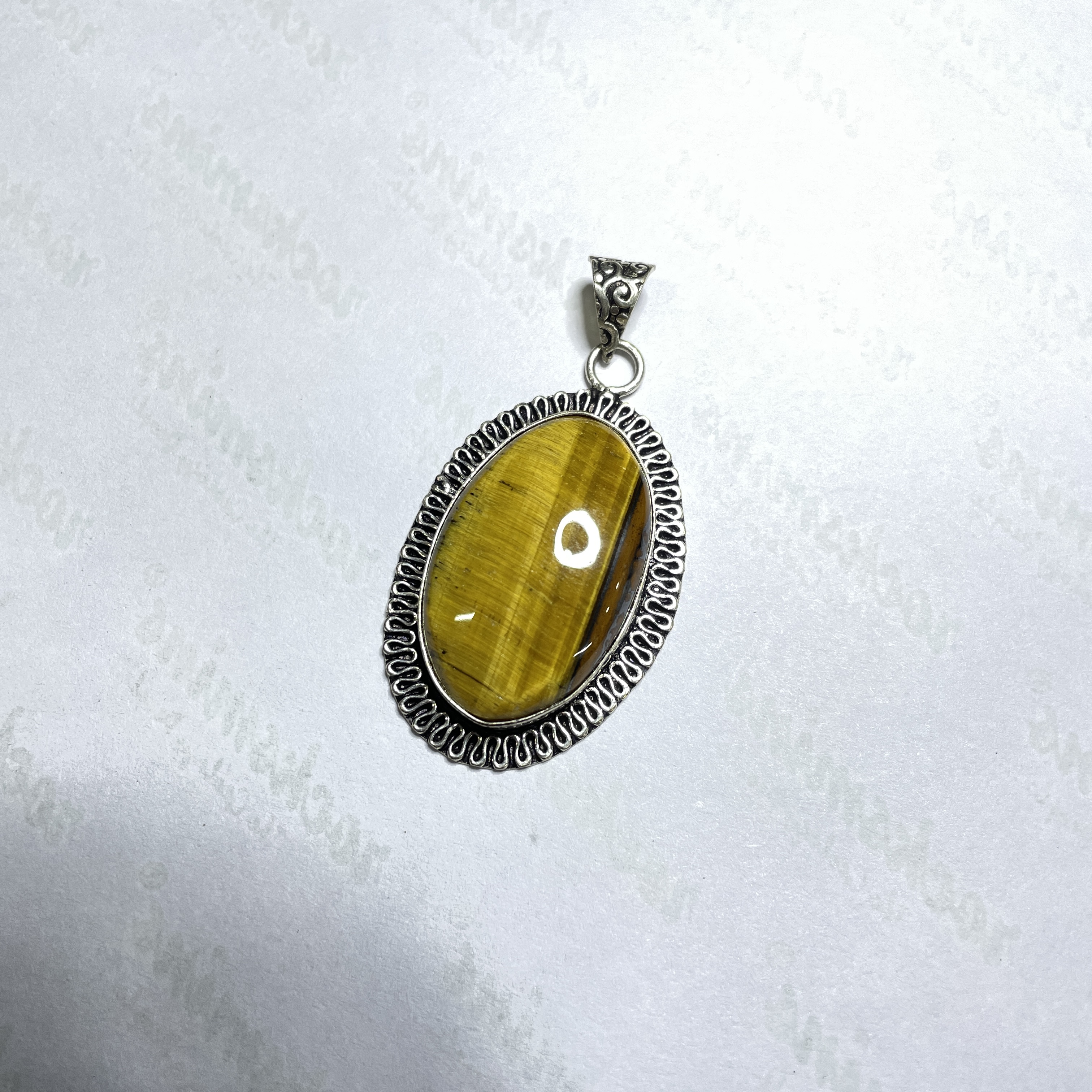 Tiger eye Yellow Crystal Pendant Discover the Power of Natural Crystals with Rocksmins. Elegantly Crafted Crystal Pendant Infused with Authentic Energies for Enhanced Well-Being and Spiritual Growth