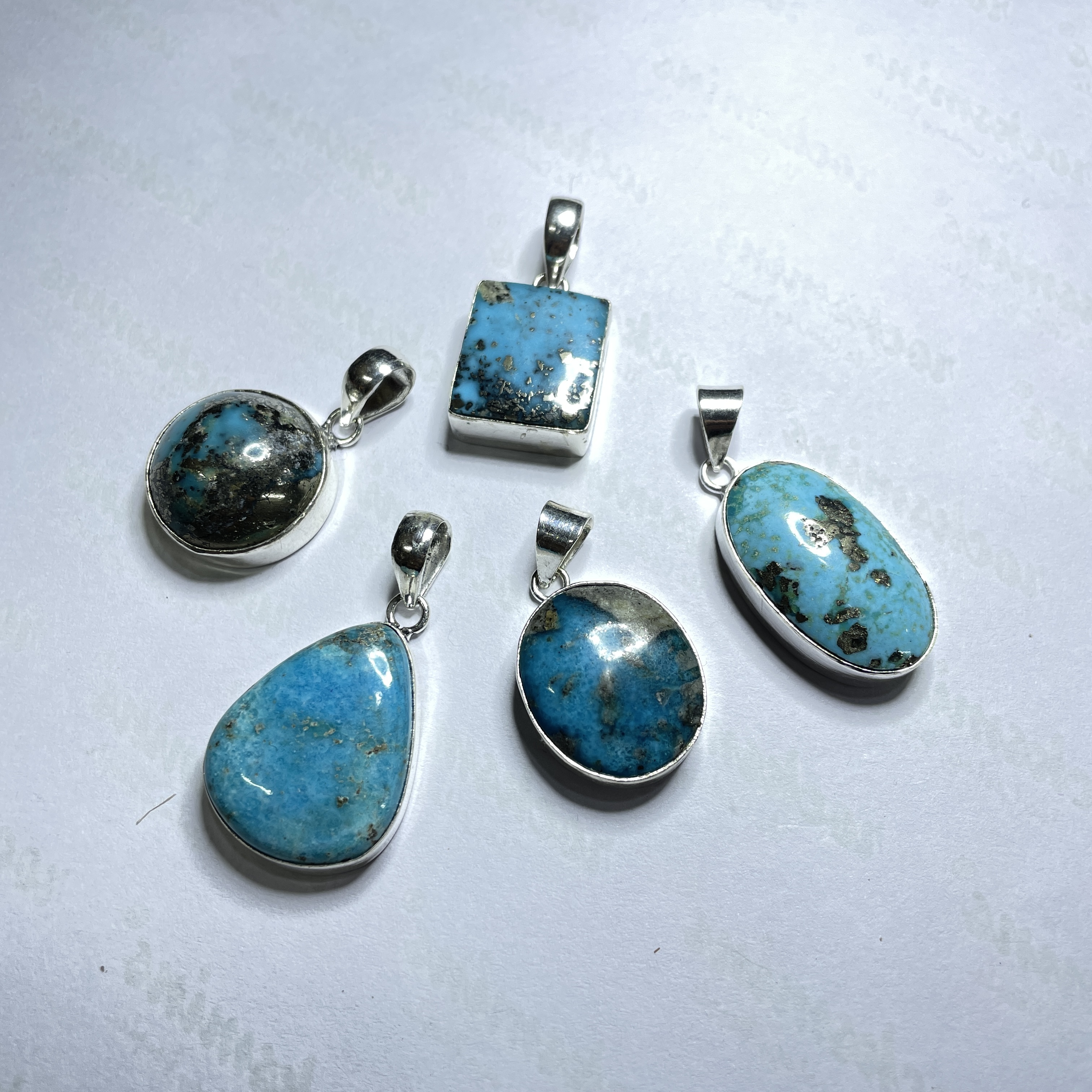 Turquoise Irani Crystal Pendant Discover the Power of Natural Crystals with Rocksmins. Elegantly Crafted Crystal Pendant Infused with Authentic Energies for Enhanced Well-Being and Spiritual Growth